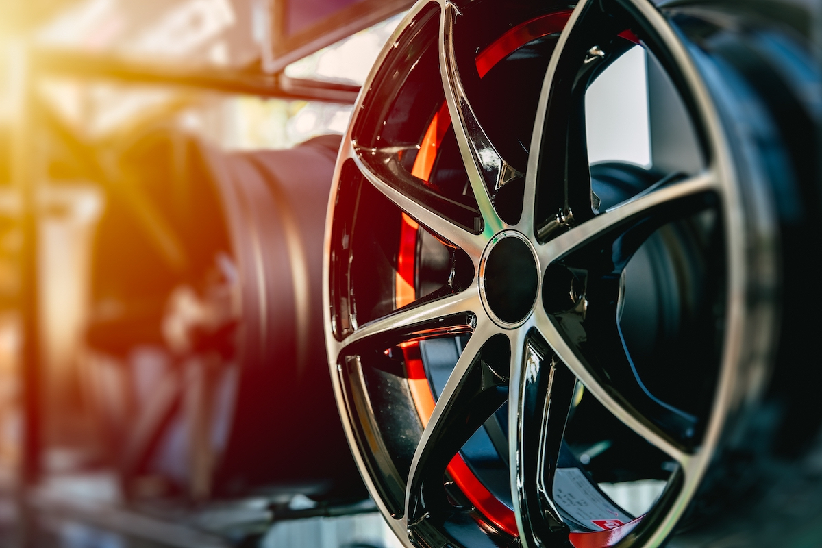 Why do automotive plants manufacture aluminum rims?